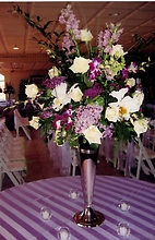 Purple and Lilac Centerpiece with Cateleya Orchids