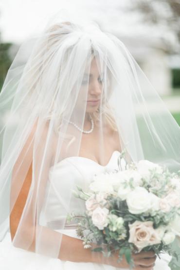 Bride with her veil and flowers